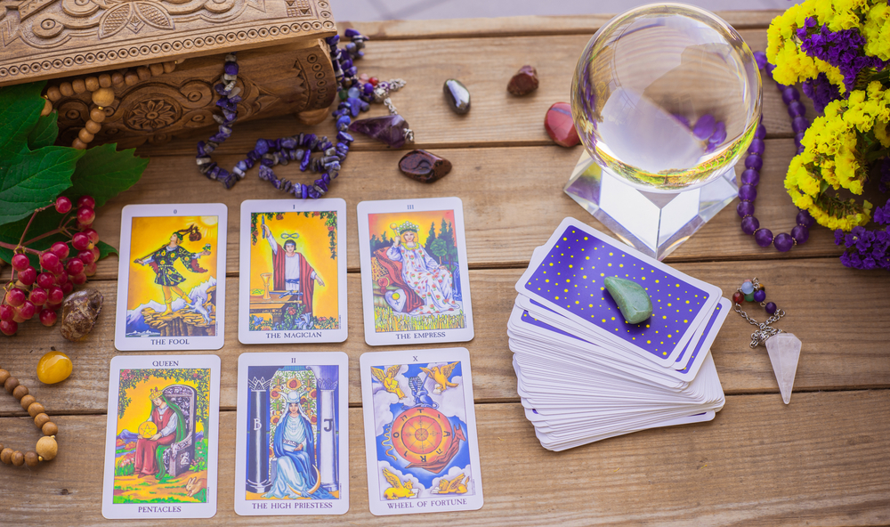 Tarot card on a table, White magic, attributes for witch, magic for love, health, attracting happiness .