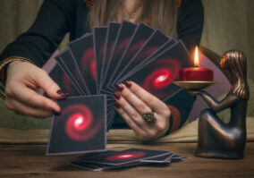 Tarot cards on fortune teller desk table. Future reading concept. Divination.